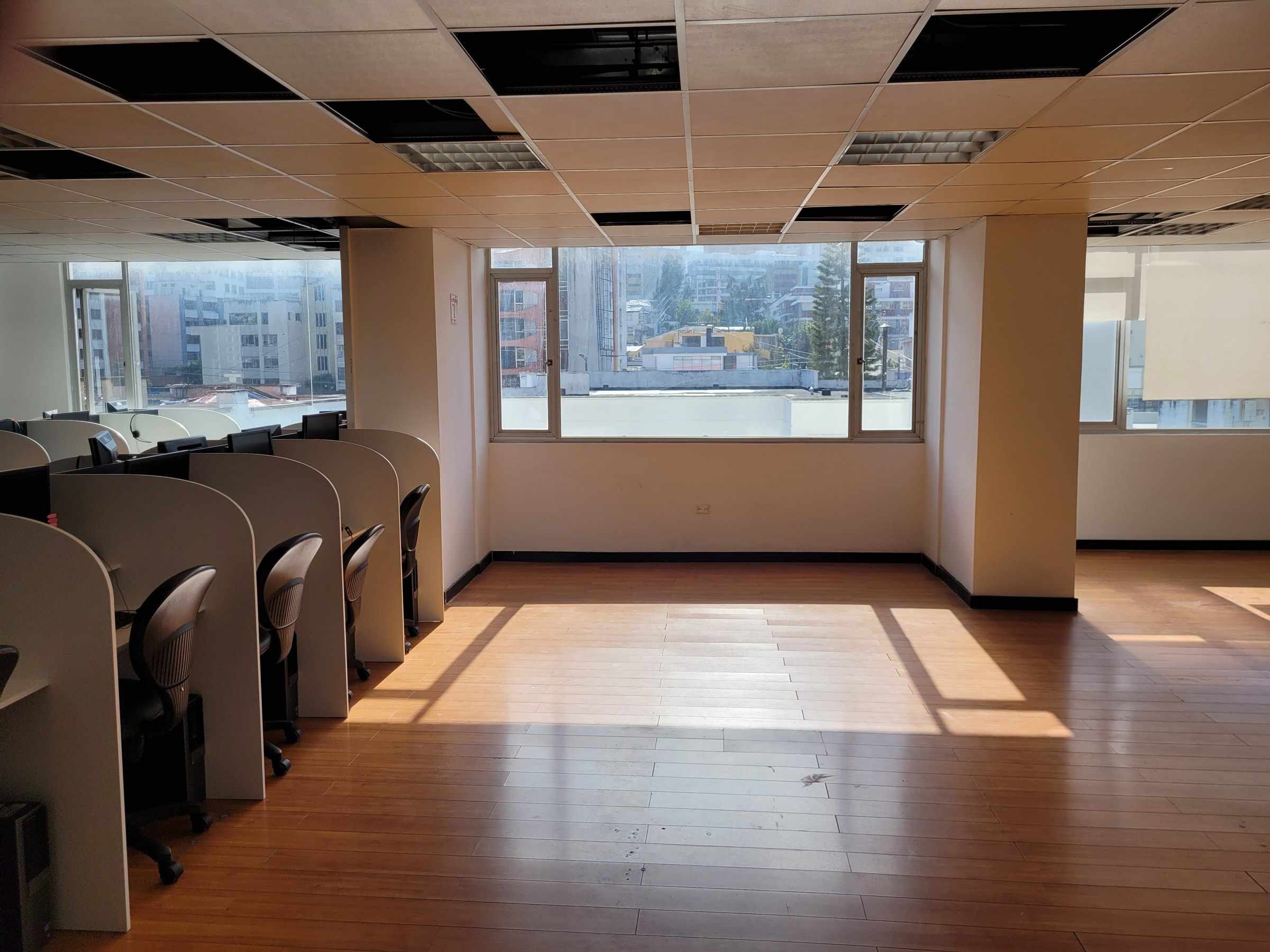 Call center floor with workstations in a Quito office building